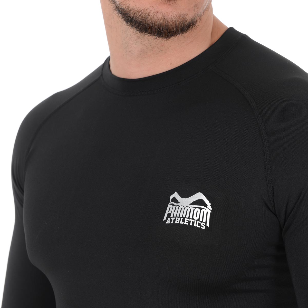 Das Compression Shirt Tactic Langarm von Phantom Athletics bietet optimalen Muskelhalt und eine enge Passform, ideal für MMA, BJJ und Muay Thai. Die langen Ärmel bieten zusätzlichen Schutz vor Hautirritationen, während das atmungsaktive Material die Haut trocken und kühl hält. Perfekt für intensive Trainingseinheiten und Sparring.